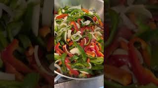 Cooking sautéed onions and peppers [upl. by Carlos]